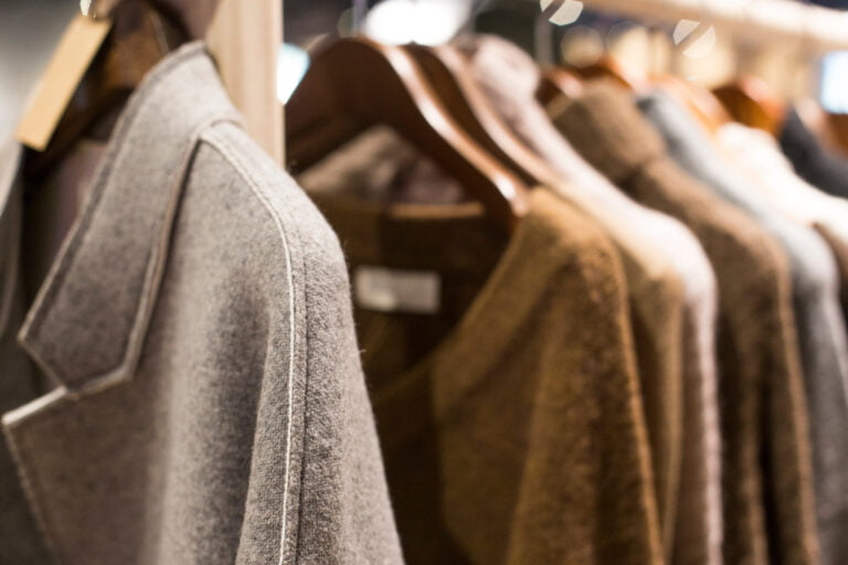 Warm winter clothes on hangers